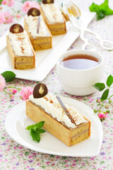 Cake of banana muffins and banana cream covered with butter cream.