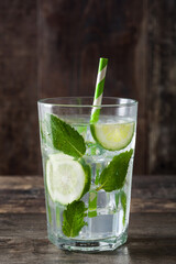 Mojito cocktail in glass on wooden table
