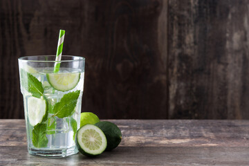 Mojito cocktail in glass on wooden table
