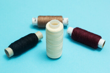 Set of threads on a blue background