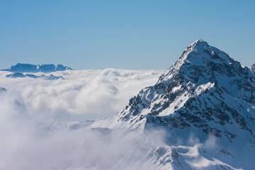 Fototapeta na wymiar DosdÃ¨ peak over the clouds in Valtellina -Lombardy