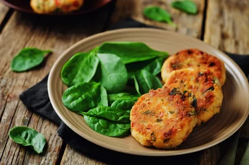 Tuinposter Salmon fritters with spinach © nata_vkusidey