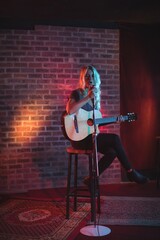Female singer performing illuminated nightclub