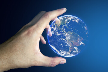 hand hold the floating globe earth Elements of this image furnished by NASA