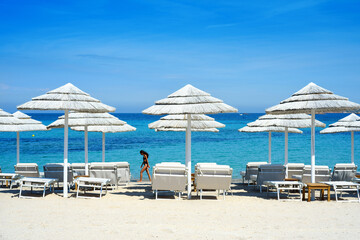 white umbrellas on the beach