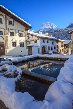 Switzerland, fountain reflection at Scoul village, Engiadin
