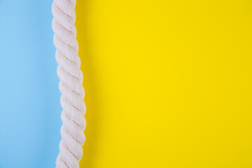 Sea rope on colored backgrounds with negative space. Summer background in minimalism.