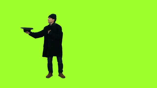 Beggar gets a coin from a man walking by, 4k footage on green background 