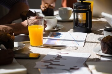 Orange juice in glass on table at cafe
