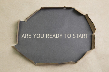 are you ready to start written under torn paper