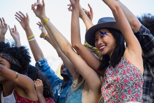 Group of female friends having fun in the music festival