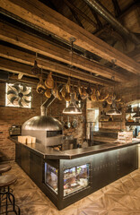 Bar and pizza oven in restaurant interior