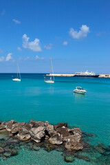 Clear blue waters of Otranto with yachts, Salento, Apulia, Italy