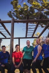 Group of fit women standing together in the boot camp