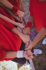 Kids playing tug of war during obstacle course training