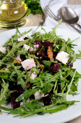 Roasted beets, arugula, cheese feta, and walnuts