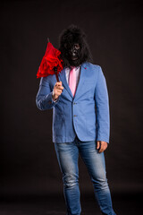 businessman wearing gorilla mask