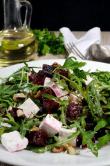 Roasted beets, arugula, cheese feta, and walnuts
