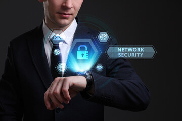 Business, Technology, Internet and network concept. Young businessman working on a virtual screen of the future and sees the inscription: Network security