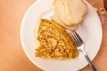 Slice of Spanish tortilla, potato omelette, served as tapas