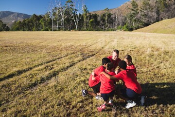 Fototapeta na wymiar Trainer instructing kids in the boot camp