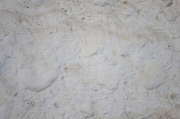 Roughly plastered stone wall