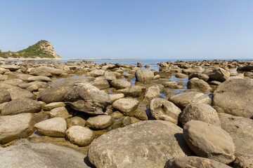 Fototapeta na wymiar Beach rocks close-up in Karpasia, island of Cyprus