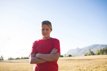 Obraz premium Girl standing with arms crossed in the boot camp