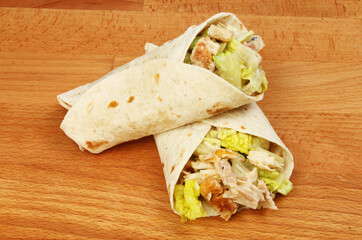 Chicken salad wraps on a board