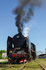 Naklejka premium LOCOMOTIVE - Historic train at railway crossings