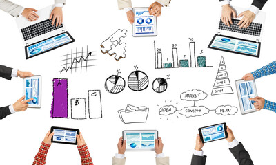 Top view of businesspeople sitting at table and using gadgets