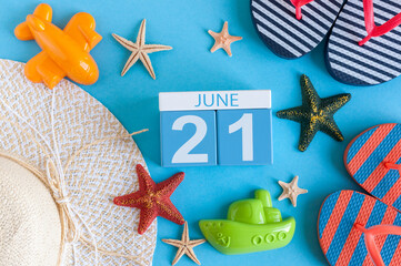 June 21st. Image of june 21 calendar on blue background with summer beach, traveler outfit and accessories. Summer day