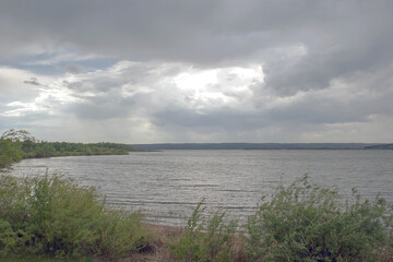 river and dark clouds