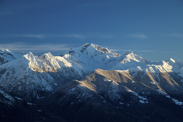 Fototapeta na wymiar Snowy peaks and Mount Disgrazia in the background Olano Gerola Valley Valtellina Rhaetian Alps Lombardy Italy Europe