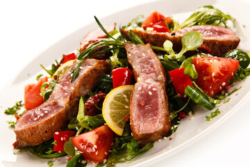 Beef with vegetables on white background