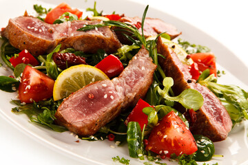 Beef with vegetables on white background