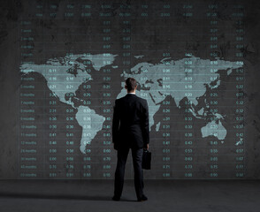 Businessman standing over diagram. World map background. Business, office, career concept.