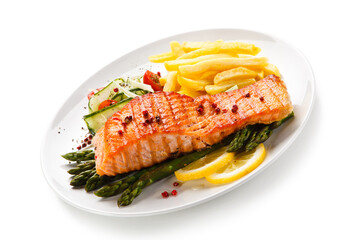 Grilled salmon, French fries and vegetables