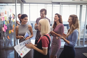 Business people making plans with adhesive notes