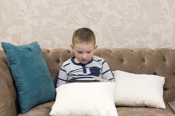 boy sitting on the couch