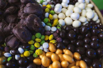 Assorted from a variety of different sweets in the glaze of white and dark chocolate, in the sugar glaze.