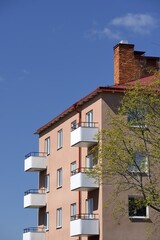 Fototapeta na wymiar Apartment Block with blue sky.