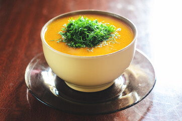 Pumpkin soup on a wooden table