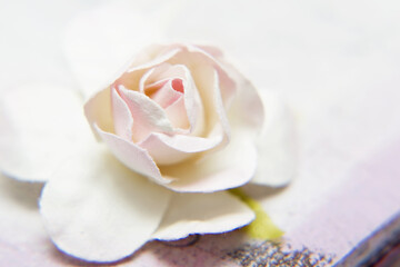 Artificial rose close up. Fabric flower for decoration products.