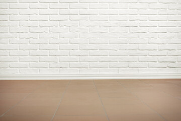 white brick wall with tiled floor, abstract background photo
