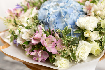 Still life with a bouquet of flowers. the florist put together a beautiful bunch of flowers. Man manual work used different types of flowers and colors. copy space