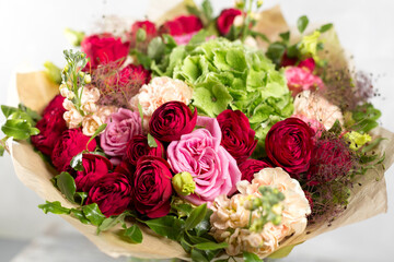 Still life with a bouquet of flowers. the florist put together a beautiful bunch of flowers. Man manual work used different types of flowers and colors. copy space
