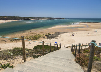 View of the sandy beach of Vila Nova de Milfontes surrounded by the blue ocean Odemira Alentejo region Portugal Europe