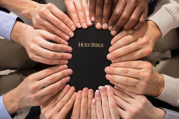 Hands Holding Holy Bible