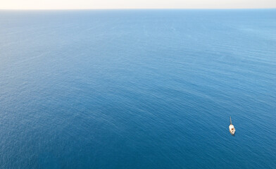 Lonely sailboat on the open sea